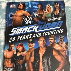 Mint condition “WWE Smackdown: 20 Years and Counting” book from 2019